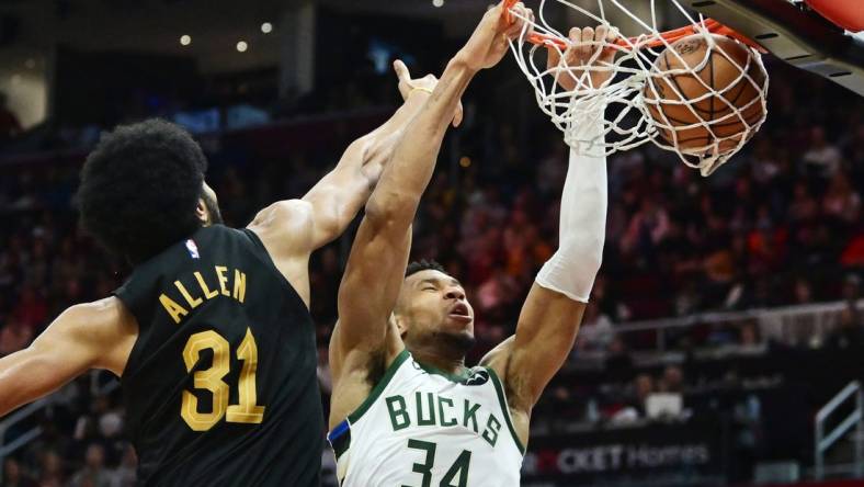 Dec 29, 2023; Cleveland, Ohio, USA; Milwaukee Bucks forward Giannis Antetokounmpo (34) dunks as Cleveland Cavaliers center Jarrett Allen (31) defends during the second half at Rocket Mortgage FieldHouse. Mandatory Credit: Ken Blaze-USA TODAY Sports