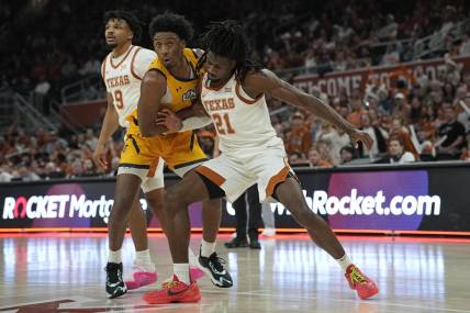 Dec 29, 2023; Austin, Texas, USA; Texas Longhorns forward Ze'Rik Onyema (21) boxes out UNC Greensboro Spartans forward Jalen Breath (22) during the second half at Moody Center. Mandatory Credit: Scott Wachter-USA TODAY Sports