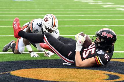 Dec 30, 2023; Nashville, TN, USA; Maryland Terrapins tight end Preston Howard (85) catches a touchdown pass against Auburn Tigers linebacker Eugene Asante (9) during the first half at Nissan Stadium. Mandatory Credit: Christopher Hanewinckel-USA TODAY Sports