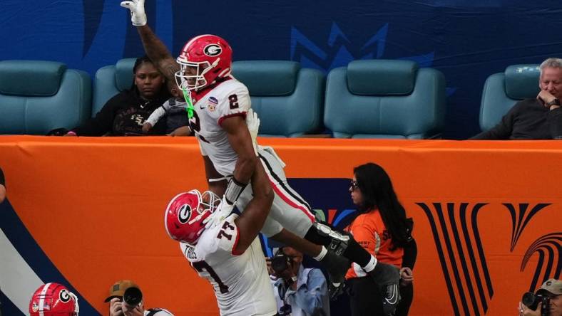 Dec 30, 2023; Miami Gardens, FL, USA; Georgia Bulldogs running back Kendall Milton (2) reacts after scoring a touchdown against the Florida State Seminoles during the first half in the 2023 Orange Bowl at Hard Rock Stadium. Mandatory Credit: Jasen Vinlove-USA TODAY Sports