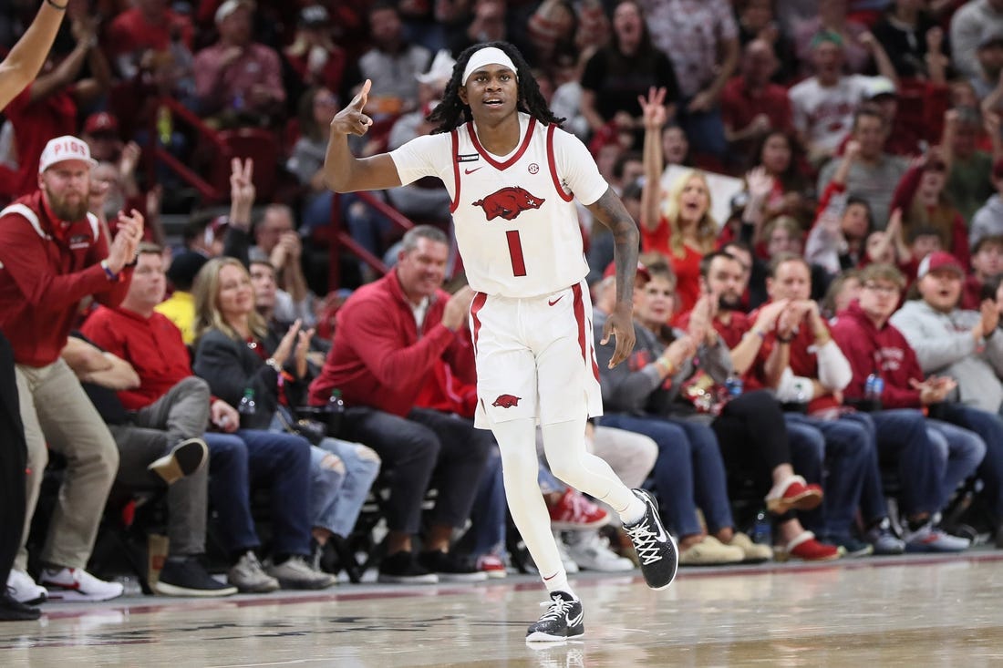 Dec 30, 2023; Fayetteville, Arkansas, USA; Arkansas Razorbacks guard Keyon Menifield Jr (1) celebrates after making a three point shot in the first half against the UNC Wilmington Seahawks at Bud Walton Arena. Mandatory Credit: Nelson Chenault-USA TODAY Sports