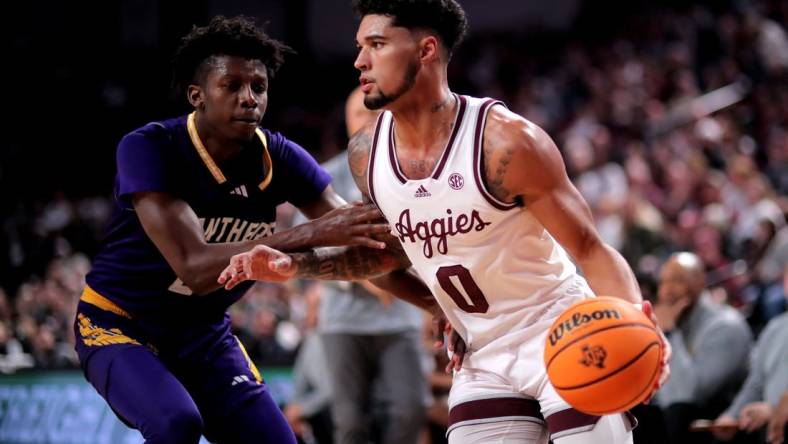 Dec 30, 2023; College Station, Texas, USA; Texas A&M Aggies guard Jace Carter (0) drives to the basket against Prairie View A&M Panthers forward Chris Felix Jr. (25) during the first half at Reed Arena. Mandatory Credit: Erik Williams-USA TODAY Sports