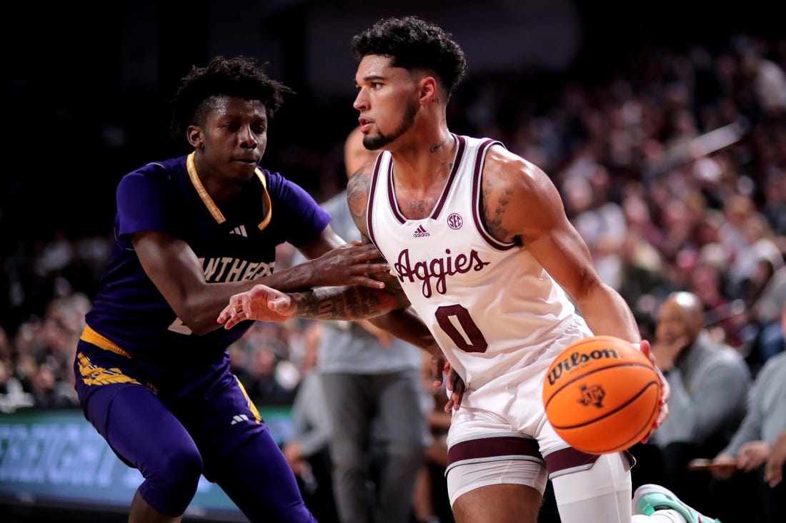 Dec 30, 2023; College Station, Texas, USA; Texas A&M Aggies guard Jace Carter (0) drives to the basket against Prairie View A&M Panthers forward Chris Felix Jr. (25) during the first half at Reed Arena. Mandatory Credit: Erik Williams-USA TODAY Sports