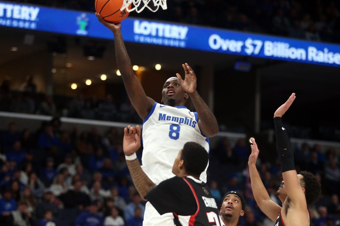 Dec 30, 2023; Memphis, Tennessee, USA; Memphis Tigers forward David Jones (8) shoots during the first half against the Austin Peay Governors at FedExForum. Mandatory Credit: Petre Thomas-USA TODAY Sports