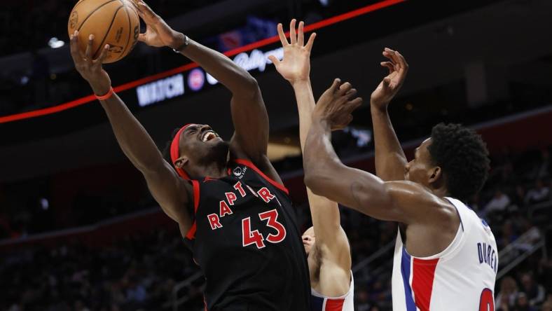 Dec 30, 2023; Detroit, Michigan, USA;  Toronto Raptors forward Pascal Siakam (43) shoots on Detroit Pistons center Jalen Duren (0) in the second half at Little Caesars Arena. Mandatory Credit: Rick Osentoski-USA TODAY Sports