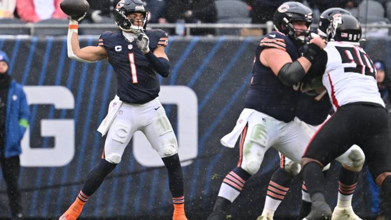 Dec 31, 2023; Chicago, Illinois, USA;  Chicago Bears quarterback Justin Fields (1) passes in the first half against the Atlanta Falcons at Soldier Field. Mandatory Credit: Jamie Sabau-USA TODAY Sports