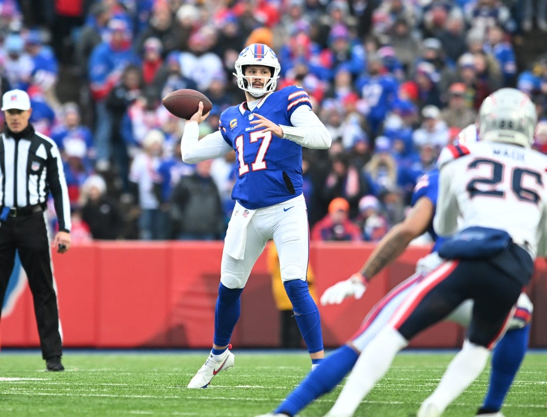 Dec 31, 2023; Orchard Park, New York, USA; Buffalo Bills quarterback Josh Allen (17) throws a pass in the first quarter against the New England Patriots at Highmark Stadium. Mandatory Credit: Mark Konezny-USA TODAY Sports