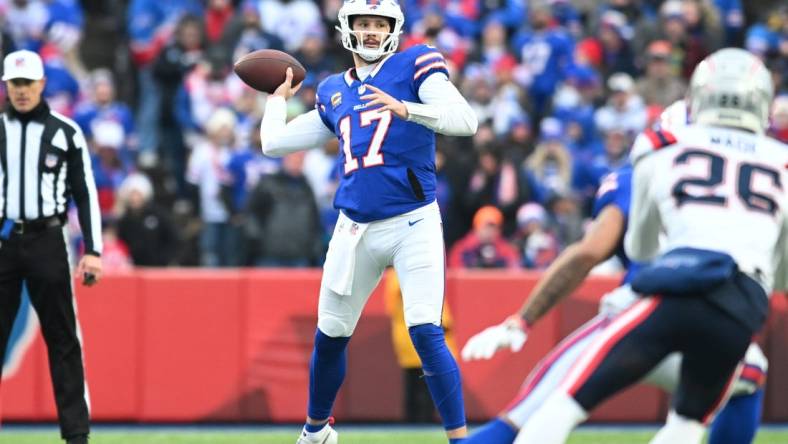 Dec 31, 2023; Orchard Park, New York, USA; Buffalo Bills quarterback Josh Allen (17) throws a pass in the first quarter against the New England Patriots at Highmark Stadium. Mandatory Credit: Mark Konezny-USA TODAY Sports