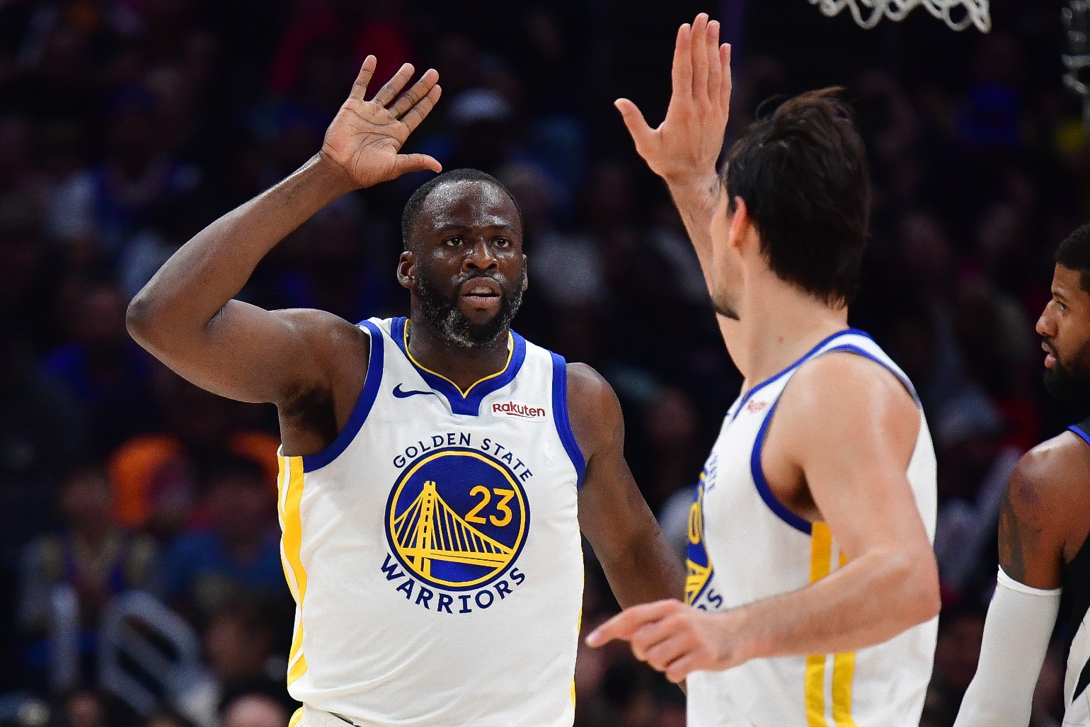 Draymond Green: Warriors Draymond Green high fives with teammate Dario Saric