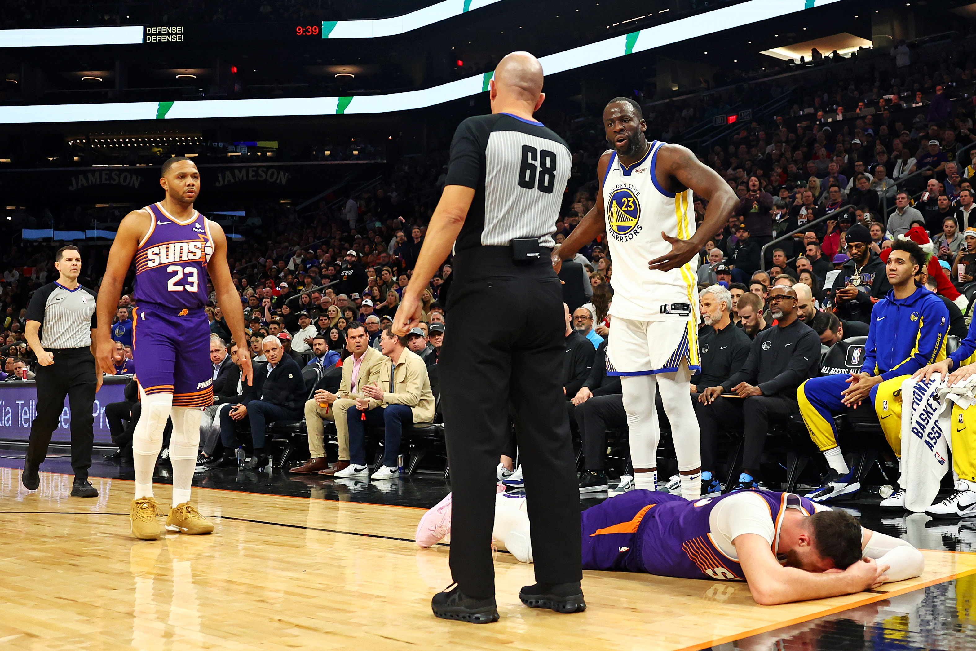 Draymond Green talks to the referee