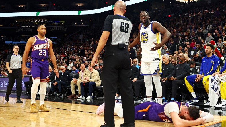 Draymond Green talks to the referee