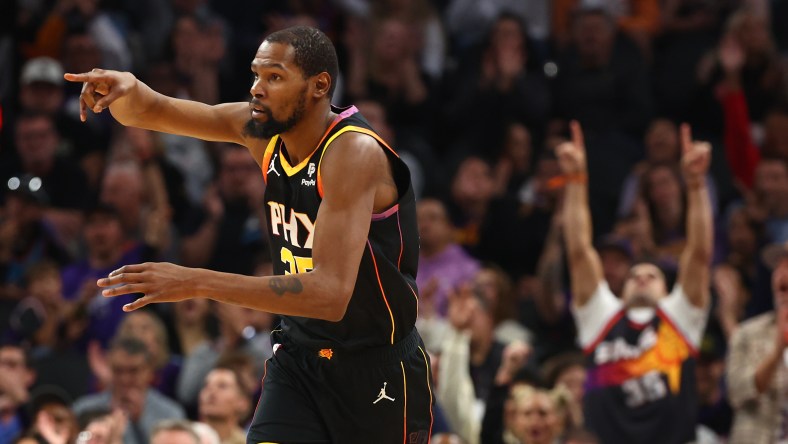 Kevin Durant reacts after hitting a 3-point shot.