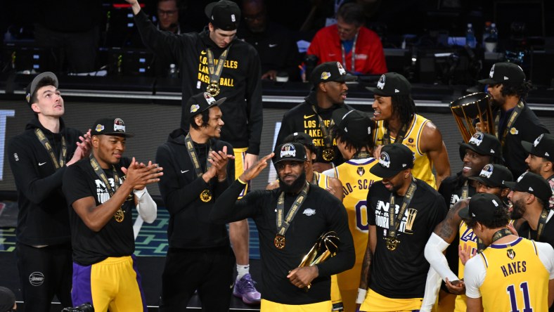 NBA In-Season Tournament: LeBron James holds up the MVP trophy.