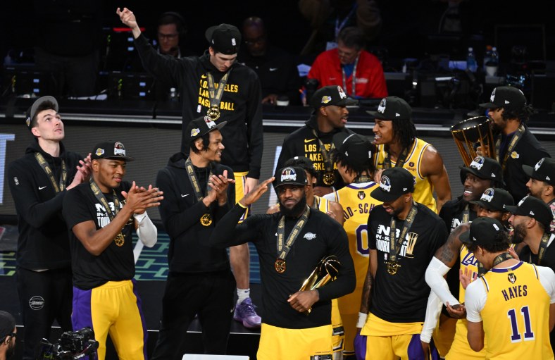 NBA In-Season Tournament: LeBron James holds up the MVP trophy.