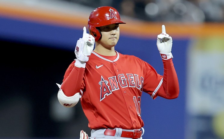 Shohei Ohtani reacts after hitting a double.