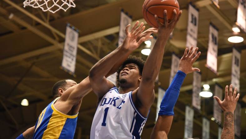 Jan 28, 2020; Durham, North Carolina, USA; Duke Blue Devils center Vernon Carey Jr. (1) shoots over Pitt Panthers forward Terrell Brown (21) during the second half at Cameron Indoor Stadium. Mandatory Credit: Rob Kinnan-USA TODAY Sports