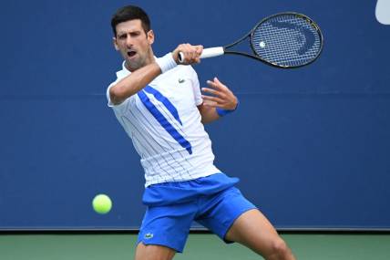 Sep 6, 2020; Flushing Meadows, New York, USA; Novak Djokovic of Serbia hits a forehand against Pablo Carreno Busta of Spain (not pictured) on day seven of the 2020 U.S. Open tennis tournament at USTA Billie Jean King National Tennis Center. Mandatory Credit: Danielle Parhizkaran-USA TODAY Sports