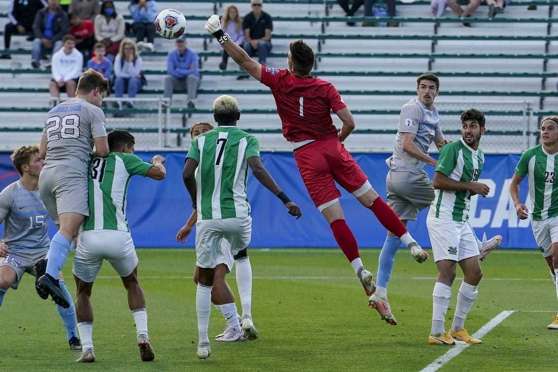 May 14, 2021; Cary, North Carolina, USA; Marshall goalkeeper Oliver Semmle (1) gets a block against North Carolina. Mandatory Credit: Jim Dedmon-USA TODAY Sports