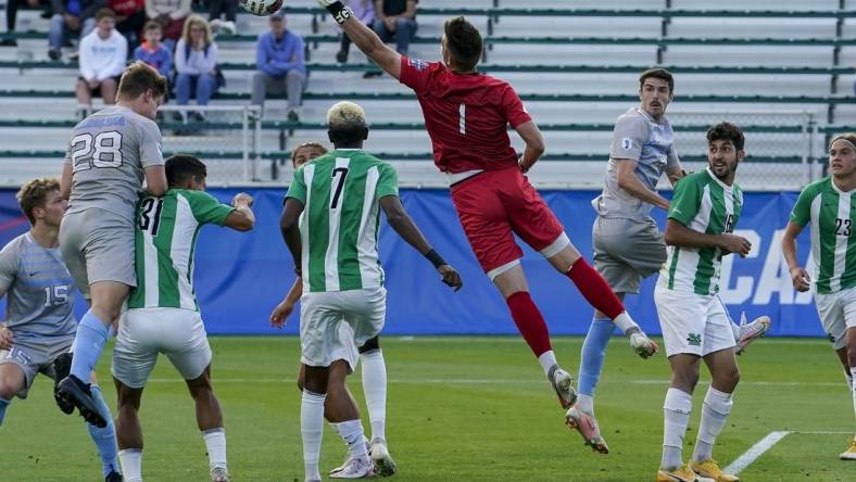 May 14, 2021; Cary, North Carolina, USA; Marshall goalkeeper Oliver Semmle (1) gets a block against North Carolina. Mandatory Credit: Jim Dedmon-USA TODAY Sports