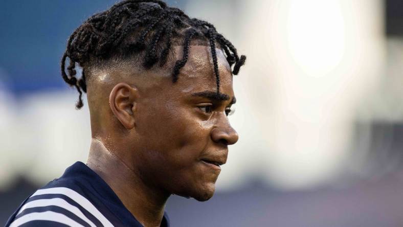 Jun 23, 2021; Foxborough, Massachusetts, USA; New England Revolution defender Dejuan Jones (24) reacts against the New York Red Bulls at Gillette Stadium. Mandatory Credit: Paul Rutherford-USA TODAY Sports