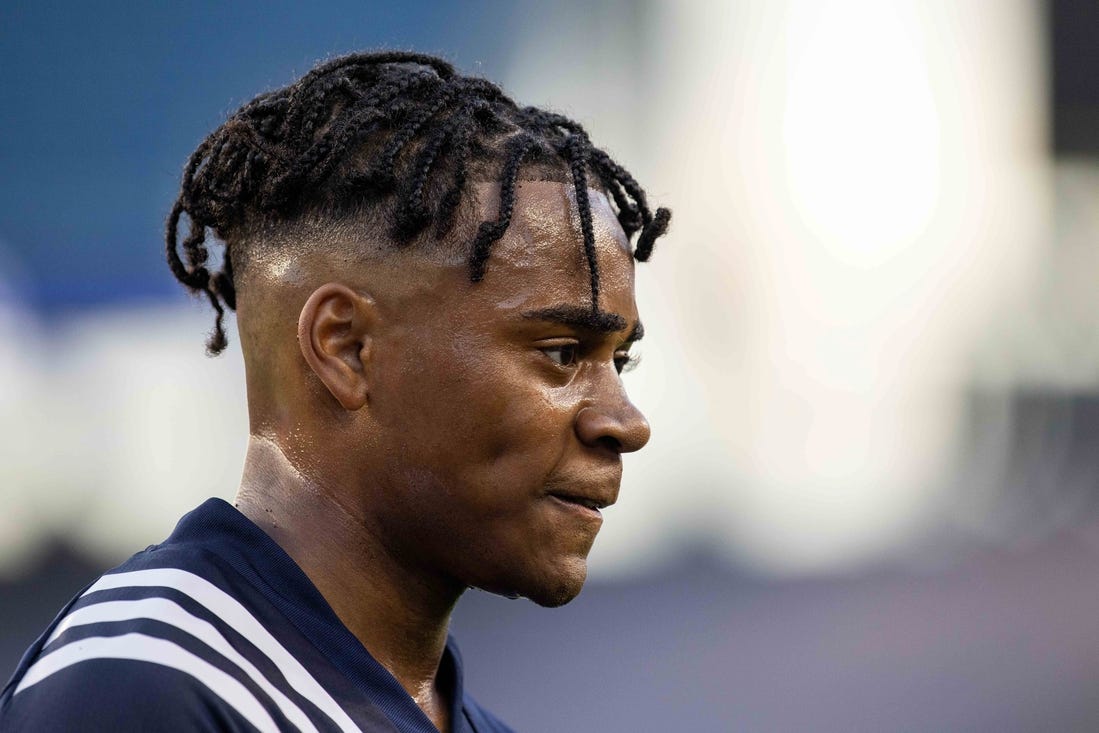 Jun 23, 2021; Foxborough, Massachusetts, USA; New England Revolution defender Dejuan Jones (24) reacts against the New York Red Bulls at Gillette Stadium. Mandatory Credit: Paul Rutherford-USA TODAY Sports