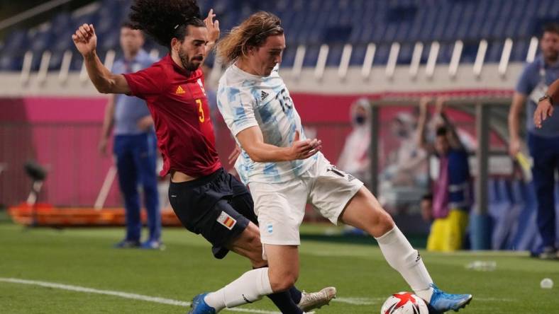 Jul 28, 2021; Saitama, Japan; Team Argentina forward Pedro de la Vega (15) battles for the ball with Team Spain defender Marc Cucurella (3) during the Tokyo 2020 Olympic Summer Games at Saitama Stadium. Mandatory Credit: Jack Gruber-USA TODAY Sports