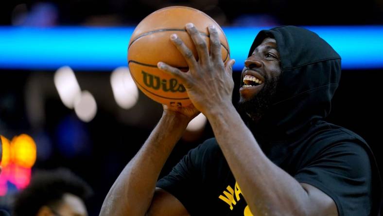 Nov 24, 2021; San Francisco, California, USA; Golden State Warriors forward Draymond Green (23) smiles during warmups before the start of the game against the Philadelphia 76ers at the Chase Center. Mandatory Credit: Cary Edmondson-USA TODAY Sports