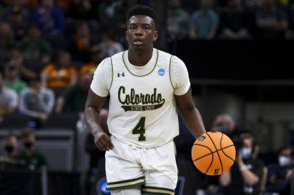 Mar 17, 2022; Indianapolis, IN, USA; Colorado State Rams guard Isaiah Stevens (4) controls the ball against the Michigan Wolverines in the first half during the first round of the 2022 NCAA Tournament at Gainbridge Fieldhouse. Mandatory Credit: Trevor Ruszkowski-USA TODAY Sports