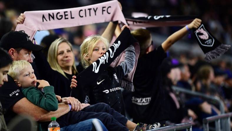 Apr 29, 2022; Los Angeles, California, USA; Young Angel City FC fans show their support during the second half of the game against the North Carolina Courage at Banc of California Stadium. Angel City FC won 2-1. Mandatory Credit: Gary A. Vasquez-USA TODAY Sports