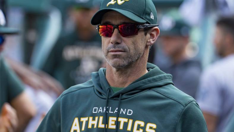 May 10, 2022; Detroit, Michigan, USA; Oakland Athletics bench coach Brad Ausmus (16) looks on from the dugout during the fourth inning against the Detroit Tigers at Comerica Park. Mandatory Credit: Raj Mehta-USA TODAY Sports