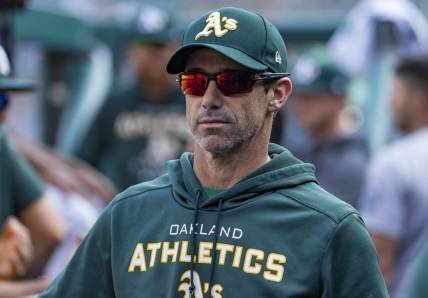 May 10, 2022; Detroit, Michigan, USA; Oakland Athletics bench coach Brad Ausmus (16) looks on from the dugout during the fourth inning against the Detroit Tigers at Comerica Park. Mandatory Credit: Raj Mehta-USA TODAY Sports