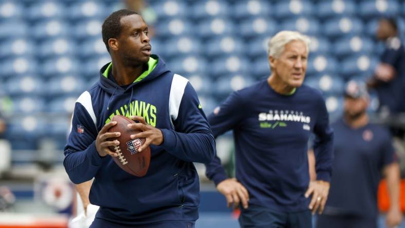 Seattle Seahawks quarterback Geno Smith and head coach Pete Carroll (background) can crash the playoffs with a win and some help from the Chicago Bears. Mandatory Credit: Joe Nicholson-USA TODAY Sports