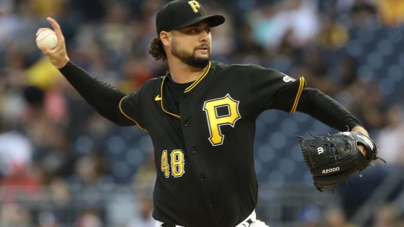 Aug 20, 2022; Pittsburgh, Pennsylvania, USA; Pittsburgh Pirates starting pitcher Tyler Beede (48) delivers a pitch  against the Cincinnati Reds during the first inning at PNC Park. Mandatory Credit: Charles LeClaire-USA TODAY Sports