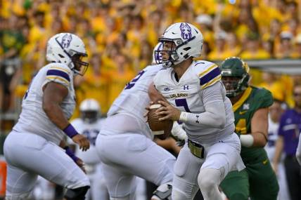 Sep 3, 2022; Waco, Texas, USA; Albany Great Danes quarterback Reese Poffenbarger (7) runs with the ball against the Baylor Bears during the first quarter at McLane Stadium. Mandatory Credit: Jerome Miron-USA TODAY Sports