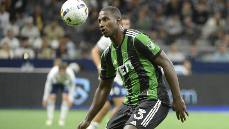 Oct 1, 2022; Vancouver, British Columbia, CAN;  Austin FC defender Jhohan Romana (3) heads the ball during the second half against the Vancouver Whitecaps FC at BC Place. Mandatory Credit: Anne-Marie Sorvin-USA TODAY Sports