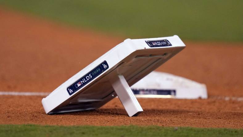 Oct 11, 2022; Los Angeles, California, USA; A detailed view of base with NLDS logo during during game at Dodger Stadium between the Los Angeles Dodgers and the San Diego Padres. Mandatory Credit: Kirby Lee-USA TODAY Sports