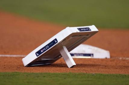 Oct 11, 2022; Los Angeles, California, USA; A detailed view of base with NLDS logo during during game at Dodger Stadium between the Los Angeles Dodgers and the San Diego Padres. Mandatory Credit: Kirby Lee-USA TODAY Sports