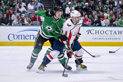 Oct 27, 2022; Dallas, Texas, USA; Dallas Stars center Roope Hintz (24) and Washington Capitals left wing Alex Ovechkin (8) in action during the game between the Dallas Stars and the Washington Capitals at the American Airlines Center. Mandatory Credit: Jerome Miron-USA TODAY Sports