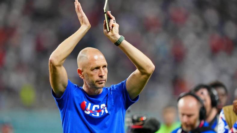 Dec 3, 2022; Al Rayyan, Qatar; United States of America manager Gregg Berhalter acknowledges fans after losing a round of sixteen match against the Netherlands in the 2022 FIFA World Cup at Khalifa International Stadium. Mandatory Credit: Danielle Parhizkaran-USA TODAY Sports