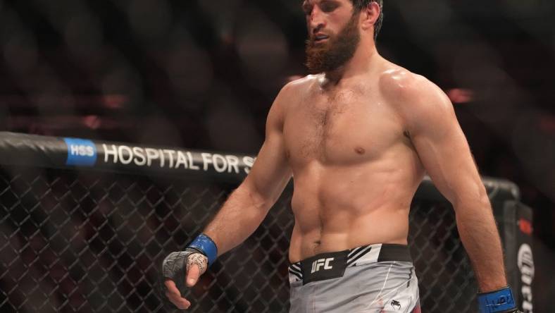 Dec 10, 2022; Las Vegas, Nevada, USA;  Magomed Ankalaev (blue gloves) reacts during the fight against Jan Blachowicz (red gloves) during UFC 282 at T-Mobile Arena. Mandatory Credit: Stephen R. Sylvanie-USA TODAY Sports