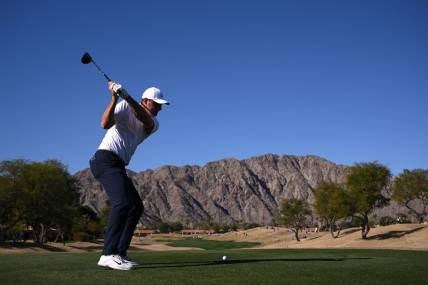 Jan 21, 2023; La Quinta, California, USA; Scottie Scheffler plays his shot from the third tee during the third round of The American Express golf tournament at Pete Dye Stadium Course. Mandatory Credit: Orlando Ramirez-USA TODAY Sports