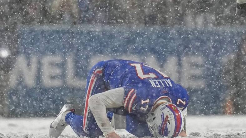 Buffalo Bills quarterback Josh Allen (17) remains down after a hard hit from Cincinnati Bengals cornerback Mike Hilton (21) in the fourth quarter of the NFL divisional playoff football game between the Cincinnati Bengals and the Buffalo Bills, Sunday, Jan. 22, 2023, at Highmark Stadium in Orchard Park, N.Y. The Bengals won 27-10 to advance to the AFC Championship game against the Kansas City Chiefs.

Cincinnati Bengals At Buffalo Bills Afc Divisional Jan 22 75