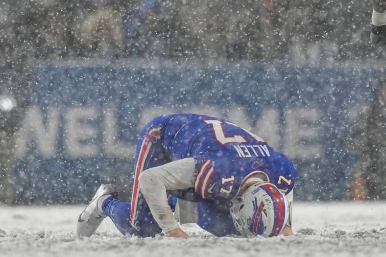 Buffalo Bills quarterback Josh Allen (17) remains down after a hard hit from Cincinnati Bengals cornerback Mike Hilton (21) in the fourth quarter of the NFL divisional playoff football game between the Cincinnati Bengals and the Buffalo Bills, Sunday, Jan. 22, 2023, at Highmark Stadium in Orchard Park, N.Y. The Bengals won 27-10 to advance to the AFC Championship game against the Kansas City Chiefs.

Cincinnati Bengals At Buffalo Bills Afc Divisional Jan 22 75