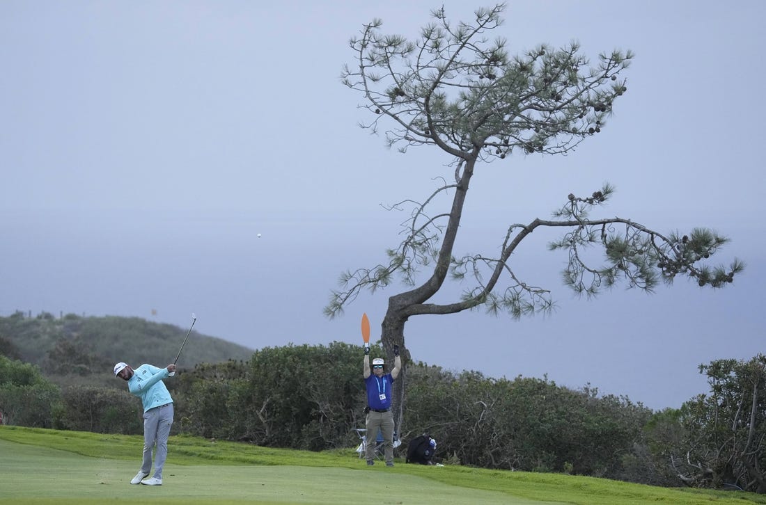 Jan 28, 2023; San Diego, California, USA; Max Homa  plays his shot on the seventeenth hole during the final round of the Farmers Insurance Open golf tournament at Torrey Pines Municipal Golf Course - South Course. Mandatory Credit: Ray Acevedo-USA TODAY Sports