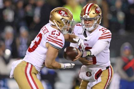 Jan 29, 2023; Philadelphia, Pennsylvania, USA; San Francisco 49ers quarterback Brock Purdy (13) hands off to running back Christian McCaffrey (23) against the Philadelphia Eagles during the fourth quarter in the NFC Championship game at Lincoln Financial Field. Mandatory Credit: Bill Streicher-USA TODAY Sports