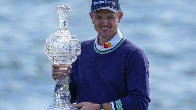 Feb 6, 2023; Pebble Beach, CA, USA; Justin Rose with the championship trophy following the continuation of the final round of the AT&T Pebble Beach Pro-Am golf tournament at Pebble Beach Golf Links. Mandatory Credit: Ray Acevedo-USA TODAY Sports