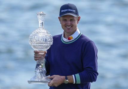 Feb 6, 2023; Pebble Beach, CA, USA; Justin Rose with the championship trophy following the continuation of the final round of the AT&T Pebble Beach Pro-Am golf tournament at Pebble Beach Golf Links. Mandatory Credit: Ray Acevedo-USA TODAY Sports