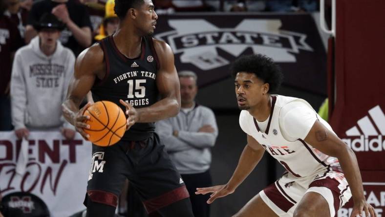 Feb 25, 2023; Starkville, Mississippi, USA; Aggies forward Henry Coleman III (15) handles the ball as Mississippi State Bulldogs forward Tolu Smith (1) defends during the first half at Humphrey Coliseum. Mandatory Credit: Petre Thomas-USA TODAY Sports