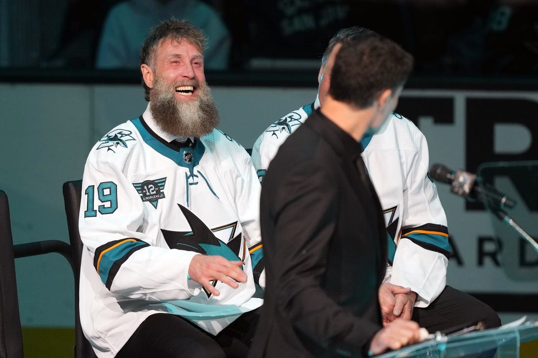 Feb 25, 2023; San Jose, California, USA; San Jose Sharks former player Joe Thornton laughs during the Patrick Marleau jersey retirement ceremony before the game against the Chicago Blackhawks at SAP Center at San Jose. Mandatory Credit: Darren Yamashita-USA TODAY Sports