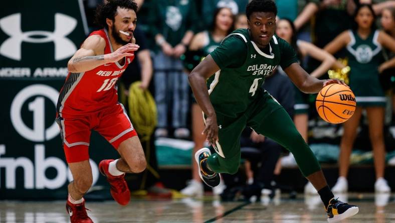 Mar 3, 2023; Fort Collins, Colorado, USA; Colorado State Rams guard Isaiah Stevens (4) dribbles the ball up court against New Mexico Lobos guard Jaelen House (10) in the second half at Moby Arena. Mandatory Credit: Isaiah J. Downing-USA TODAY Sports